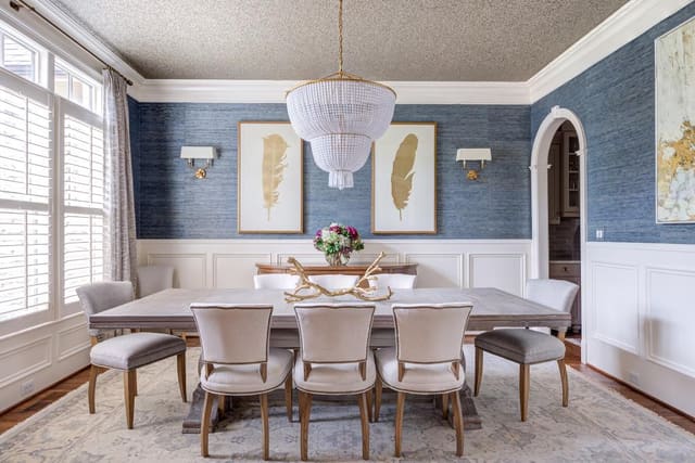 Elegant Century dining room table with eight custom Lee Industries chairs surrounding the table.