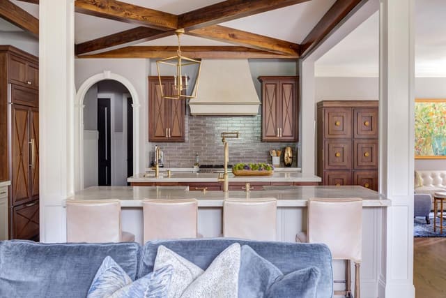 Open concept kitchen with two marble islands.