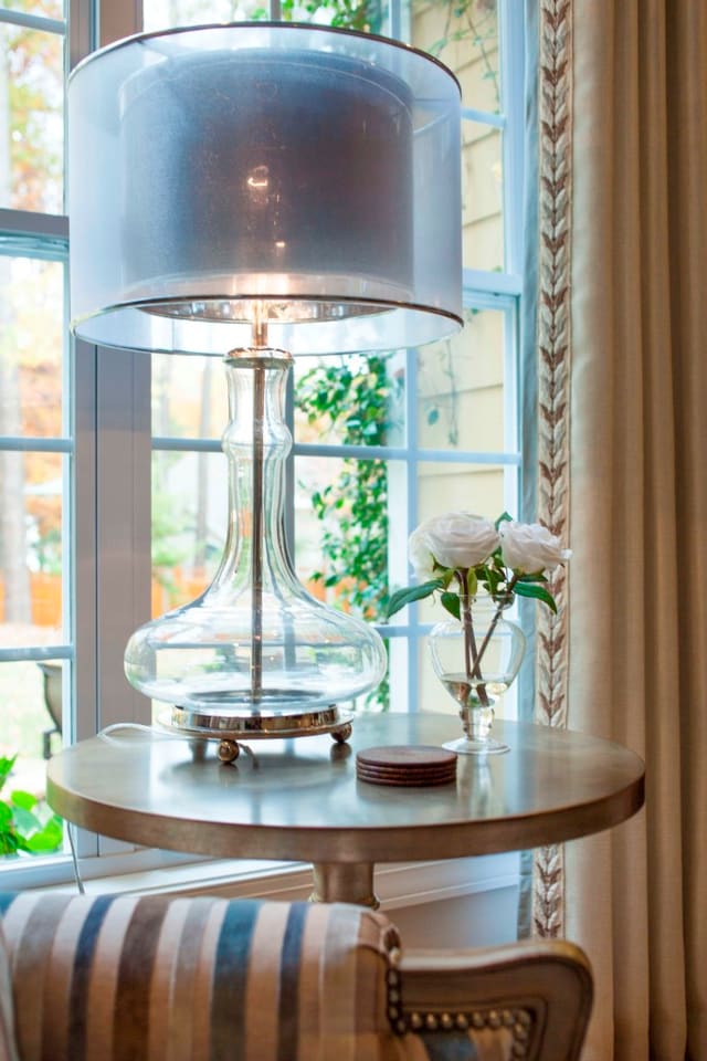 Beautiful glass lamp with double shade on side table