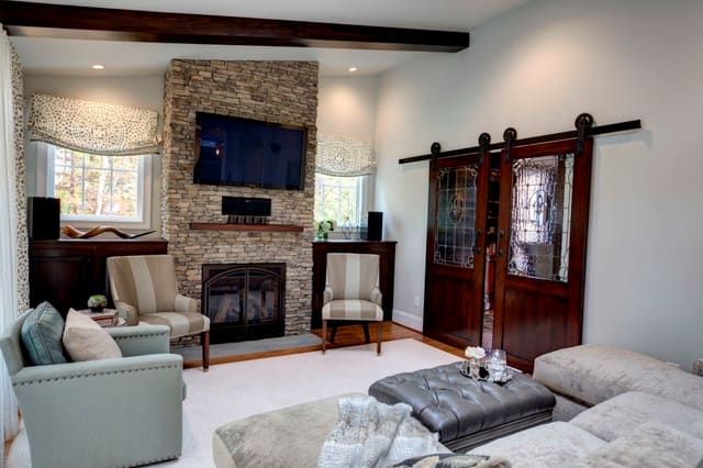 Hearth Room with stone fireplace and Barn doors
