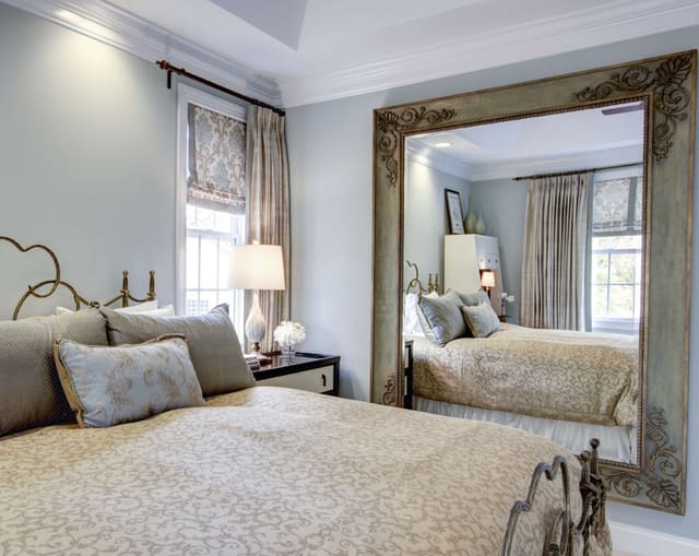 Master Bedroom with large wall mirror and unique window treatments