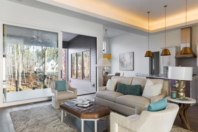 Living Room of Apex Home with sofa, swivel chairs and leather ottoman