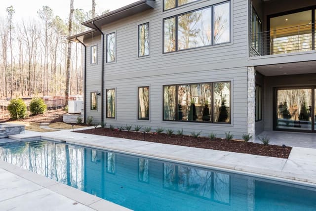 Exterior back of Apex home with pool