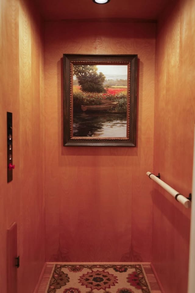 Elevator made more inviting with artwork and rug