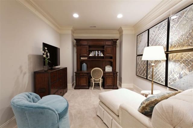 Cute loft with framed map series, desk with credenza and file cabinet, chaise, and velvet swivel chair