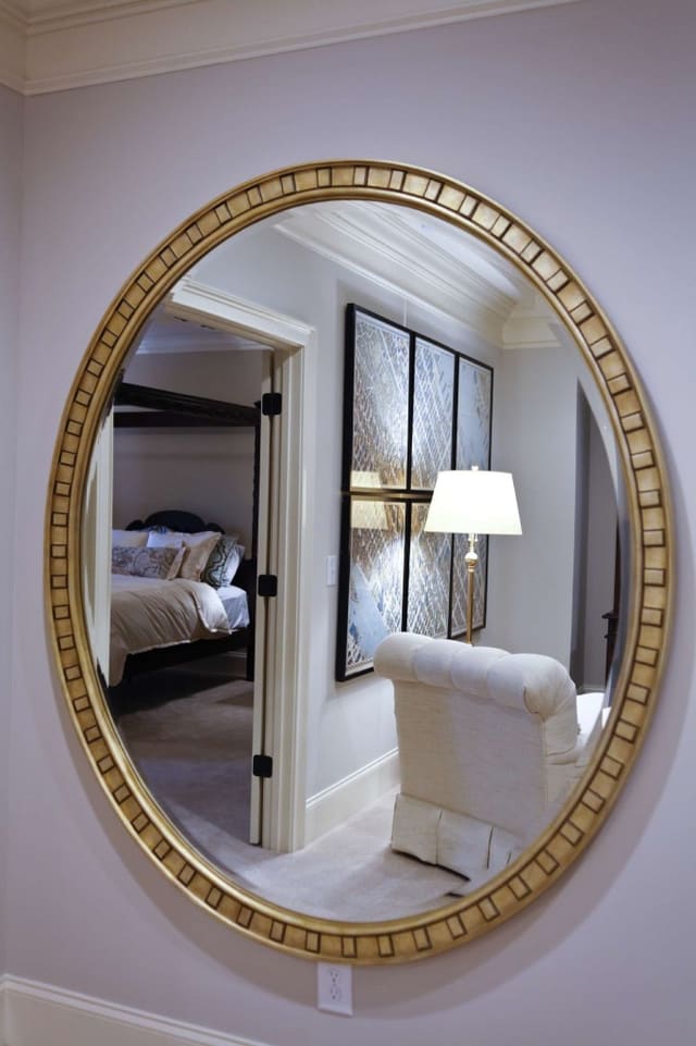 Large gold mirror reflecting Loft and Master Bedroom