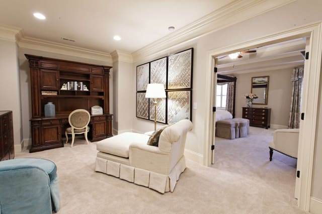 Cute loft with framed map series, desk with credenza and chaise, looking into Master Bedroom