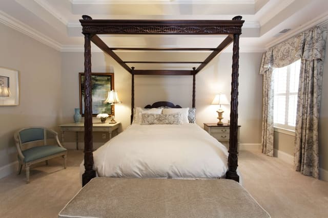 Lovely Master Bedroom with Dark Wood Bed, Drapery Panels with Cornices, Custom Bedding, and Original Arwork