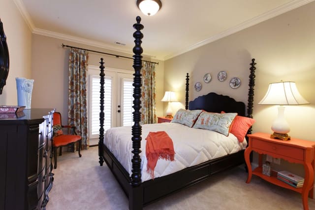 Aqua and Coral colors in Guest Bedroom with plates on wall as art
