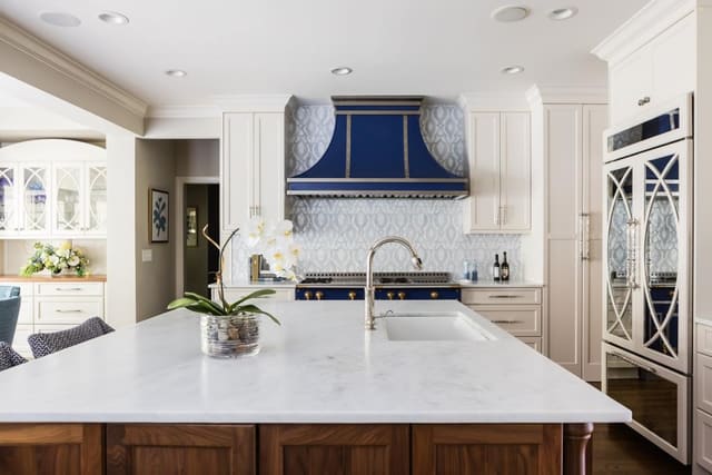 Cary Kitchen featuring white countertops, cream cabinets, and custom blue range hood