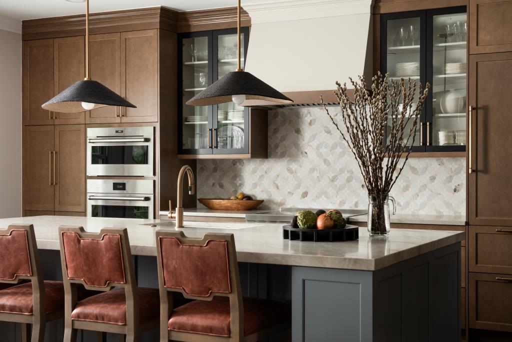 Contemporary kitchen with blue-gray island and statement pendants