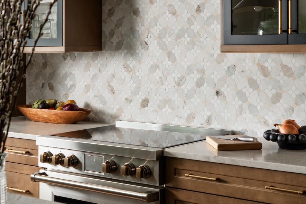 Natural Tone Backsplash with Warm Wood Cabinetry and Gold hardware