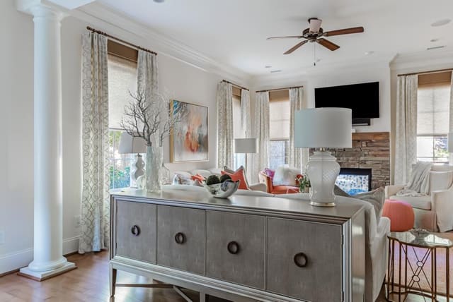 View from Dining Room into Living Room featuring 4-door cabinet in platinum finish