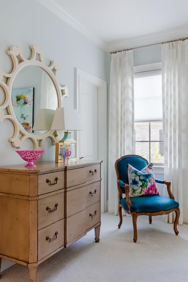Soothing blue bedroom with cream chevron drapery