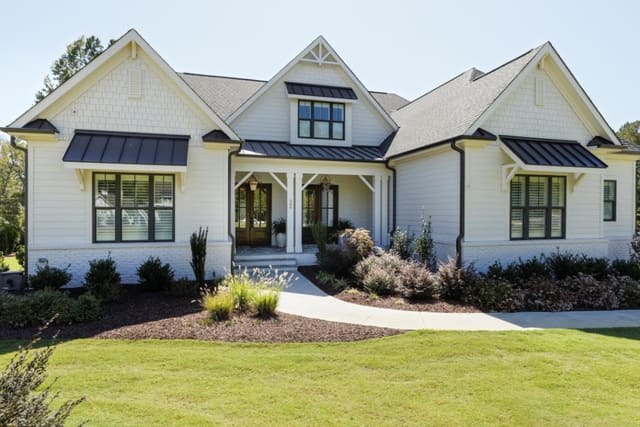 Exterior of Chapel Hill home with white siding and white painted brick