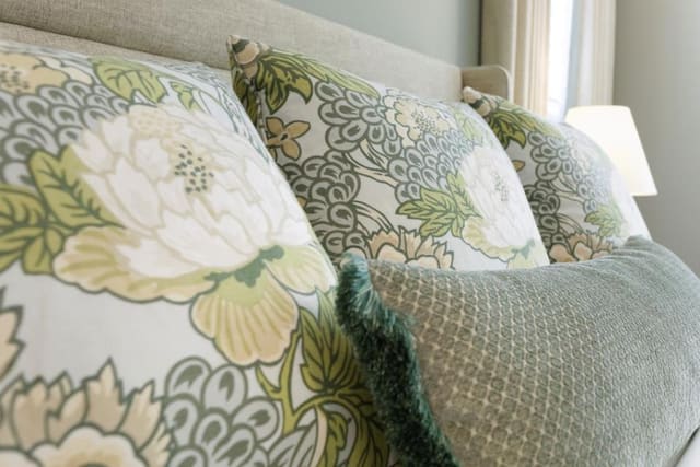 Custom pillows on Master Bedroom bed