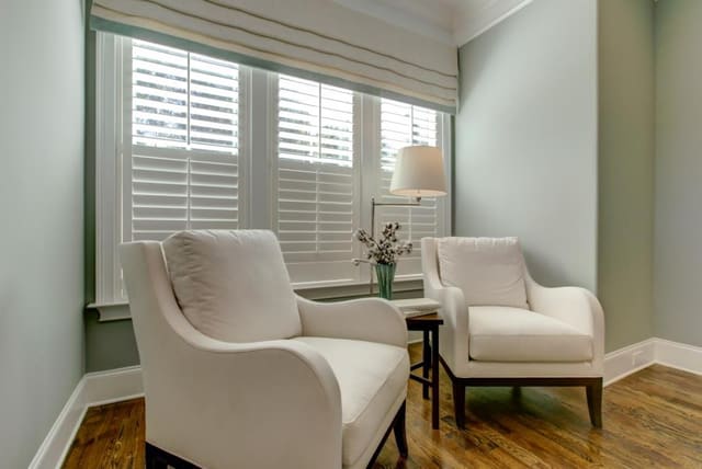 Pair of chairs in Master Bedroom with custom roman shade over window