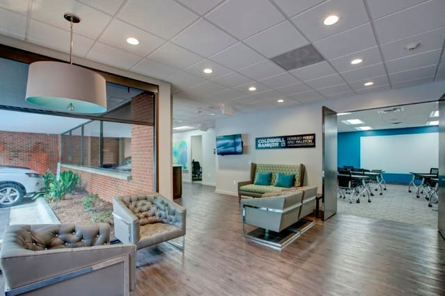 Office Lobby with sleek furniture in brown and turquoise hues