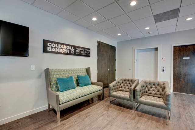 Office Lobby with sleek furniture in brown and turquoise hues