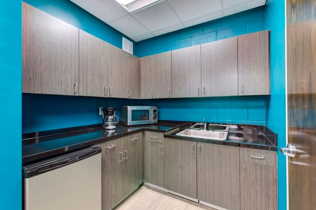 Office Break Room with custom cabinets and turquoise walls