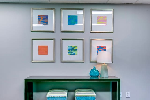Fun artwork series over credenza