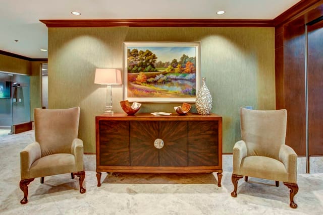 Credenza and Chairs in Paragon Bank Lobby with original artwork, lighting, and accessories