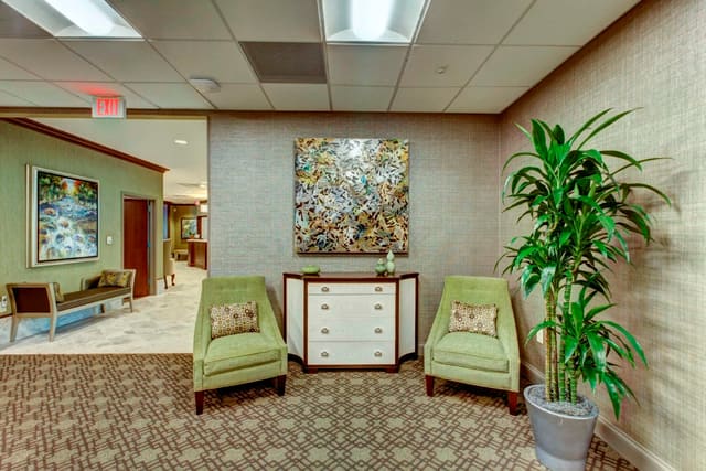 Seating area at Paragon bank with chest and original artwork