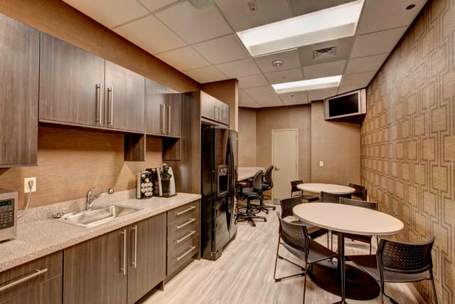 Break Room with sleek cabinetry and geometric wallpaper