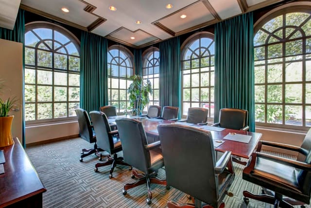 Custom drapery panels on arched window in Second Floor Conference Room at Paragon Bank