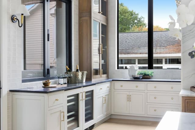 White wood cabinetry and gold hardware