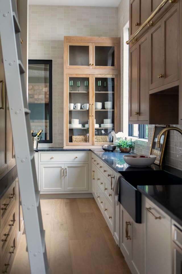 Butler's Pantry with Glass front upper cabinetry and warm woods
