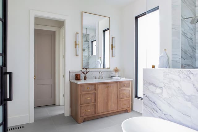 Master bath with warm wood cabinets
