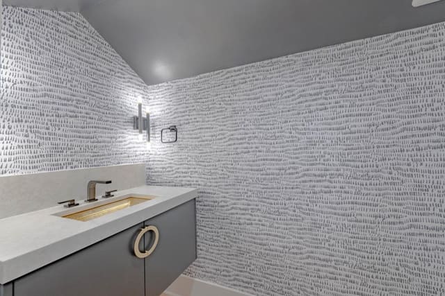 Powder Bath with Grey Patterned Wallpaper