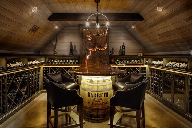 Wine Room converted from unfinished Attic Space with paneled ceiling and cork floor.