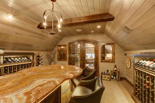 Wine Room converted from unfinished Attic Space with paneled ceiling and cork floor.