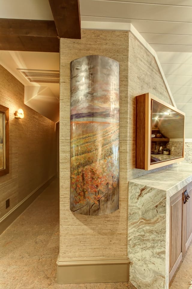 Custom metal artwork on grasscloth wallpaper
