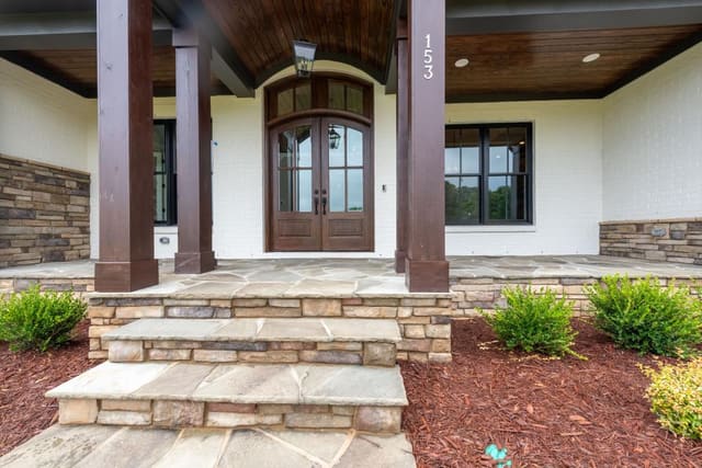 Front Steps to Porch with Neutral Stone