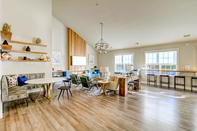 Club Room at Indigo Apartments with sitting area and banquette dining area