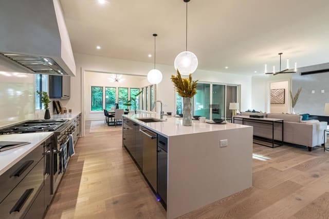 Open concept kitchen with globe pendants.
