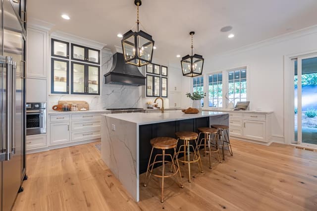 Kitchen of Raleigh home featuring black lantern pendants