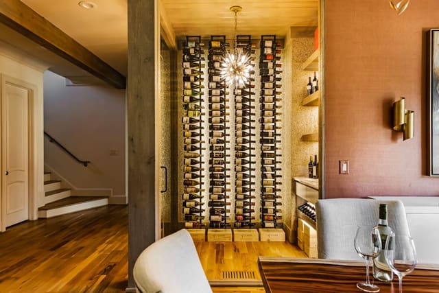 Custom wallpaper in the Wine Room and Dining Room create the perfect backdrop for entertaining.