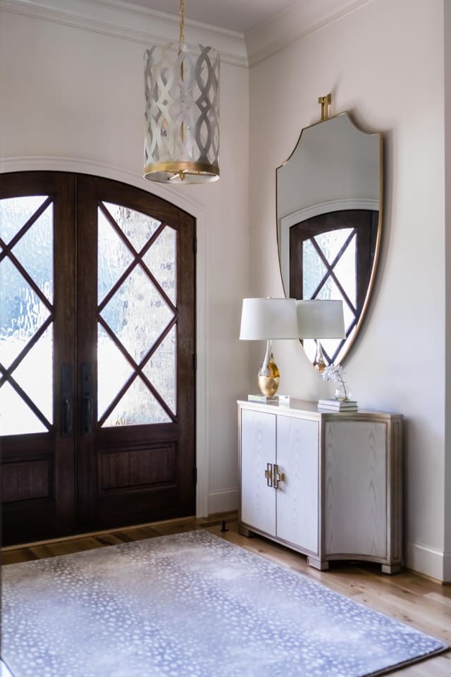 Foyer of Jordan Lake home featuring gorgeous doors!