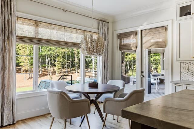 This coco chandelier adds the perfect amount of texture to this soft natural Breakfast Nook.