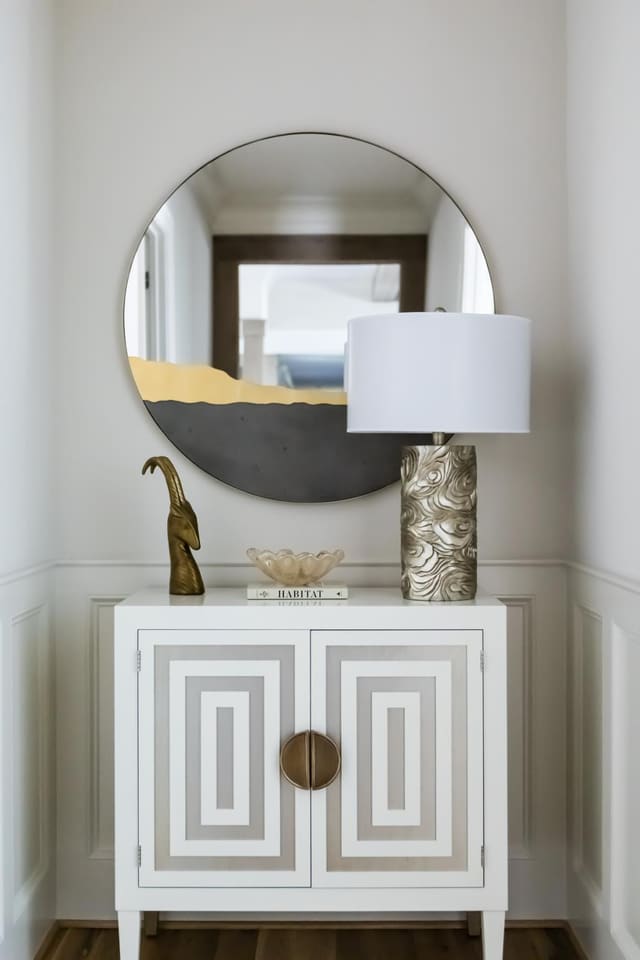 Beautiful Hallway vignette in neutral palette with mixed materials.