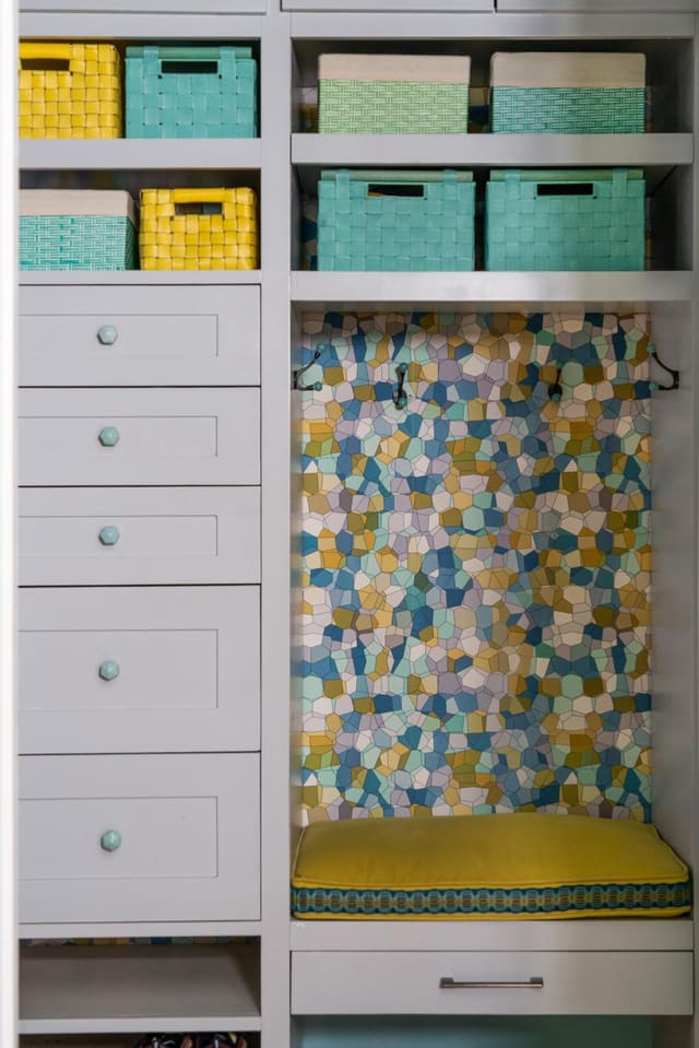 Mudroom with coloful geometric wallpaper