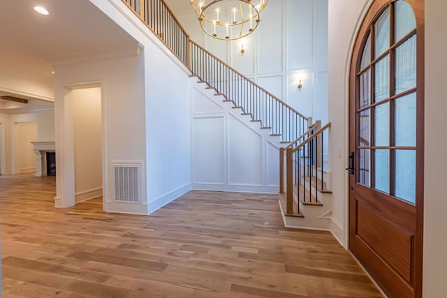 Open concept foyer with warm tones