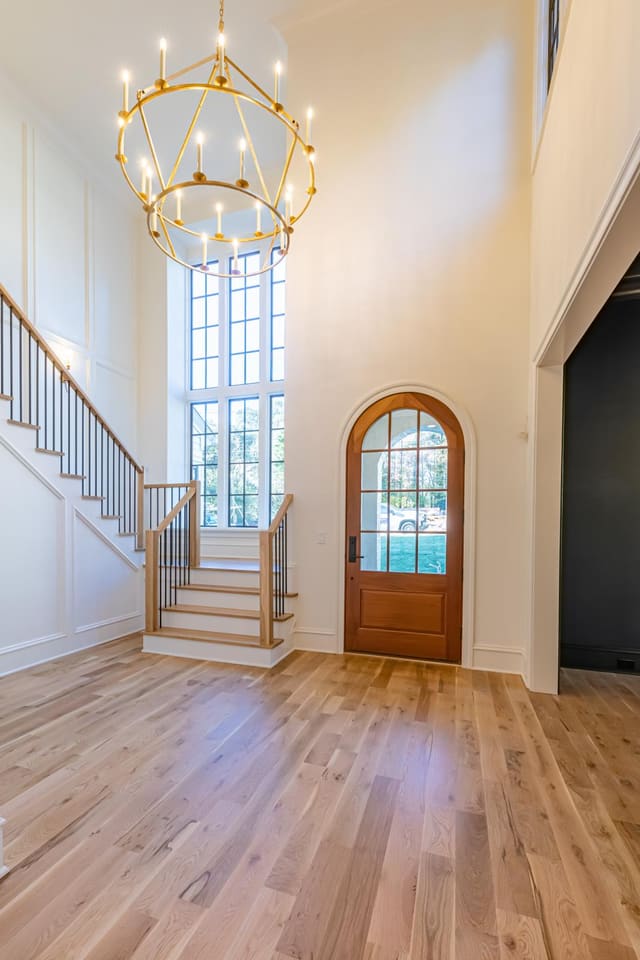 Foyer with visual comfort gold chandelier