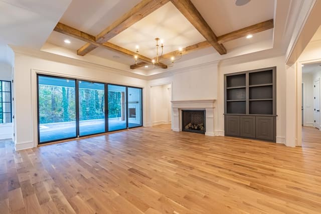 Open concept living room with beamed ceiling