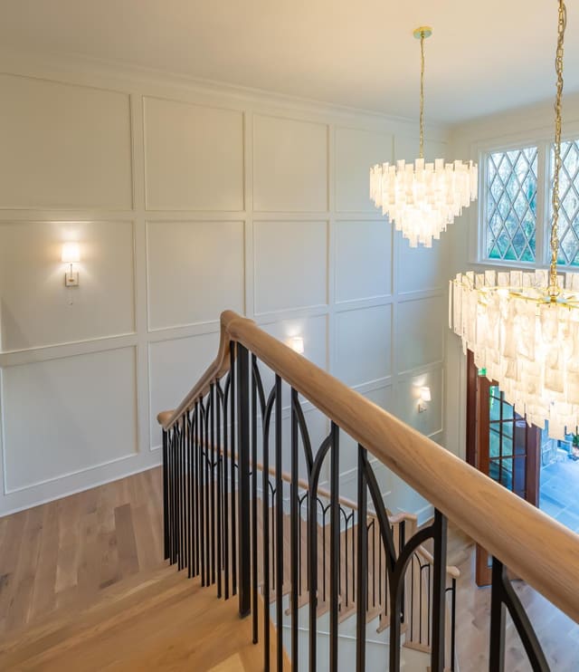 Panelled wall with warm lighting.