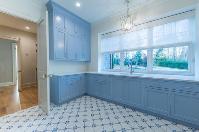 Laundry Room with white and blue flooring.